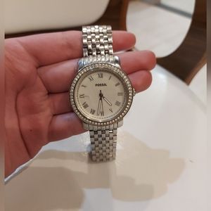 Fossil men's wrist watch with small crack in faces glass cover